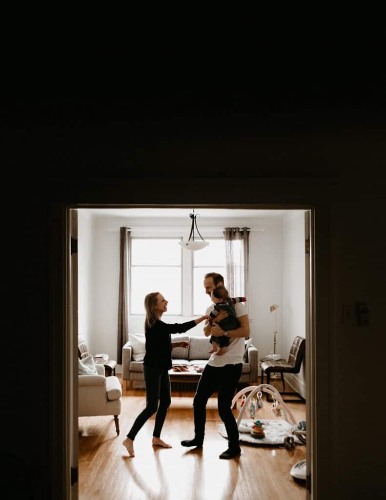 Family dancing together in the living room