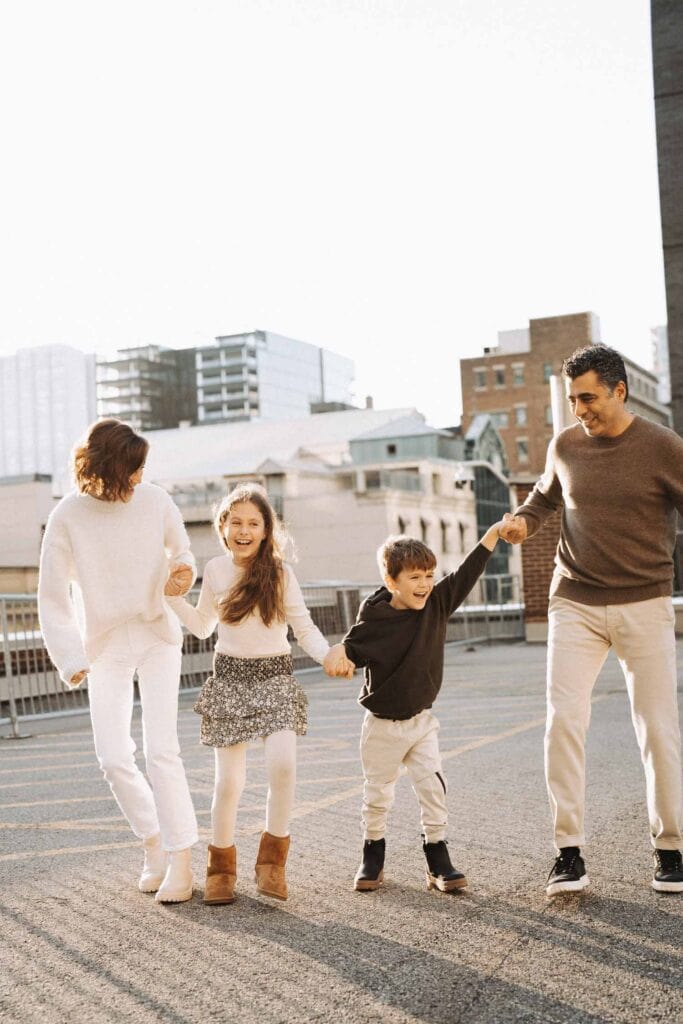 family walking and laughing on montreal rooftop urban scene