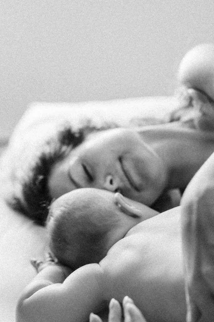 mom in bed with baby enjoying a moment of quiet